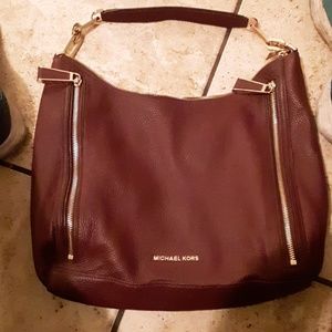 I have a plum colored Michael Kors purse.